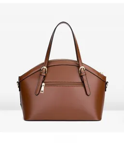 Detailed back view of a brown crocodile pattern handbag with zipper pocket and gold hardware