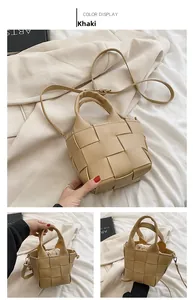 Detail of khaki woven PU leather handbag with drawstring liner and crossbody strap