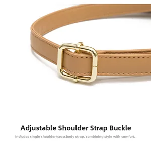 Detail of adjustable faux leather shoulder strap with a golden square metal buckle