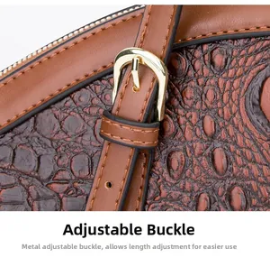 Detail of brown crocodile pattern leather with adjustable golden metal buckle and stitching