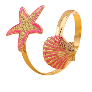 Golden starfish and pink seashell open bracelet with summer beach vacation style