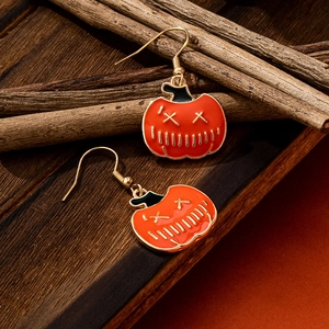 Cute Halloween pumpkin drop earrings with orange enamel Jack-o'-lantern design