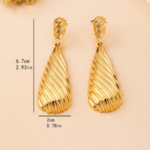 Exaggerated golden teardrop earrings with textured leaf pattern and measurements