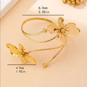 Elegant gold flower and butterfly open cuff bracelet with layered dual ring design
