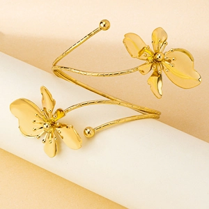 Elegant gold flower open bangle featuring detailed petals and textured metallic finish