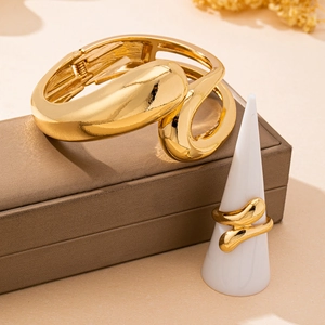 Minimalist gold organic jewelry set with fluid bangle and matching open ring