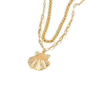 Double-layered golden necklace with seashell pendant and sparkling crystals