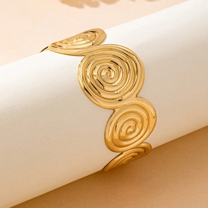 Luxurious gold-tone spiral textured cuff bracelet with elegant embossed geometric patterns