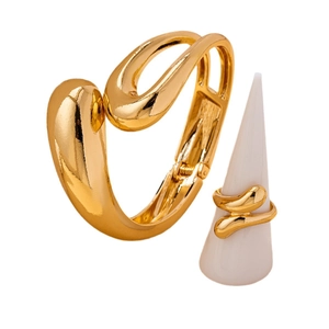 Polished gold jewelry set with minimalist curved bangle and matching ring for women