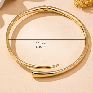 Minimalist gold geometric spring torque necklace with dimensions and polished finish