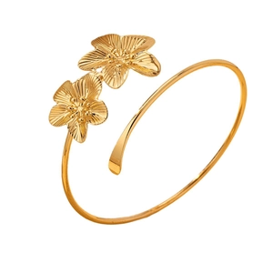 Elegant gold open cuff bracelet with two detailed floral petals in a brushed finish