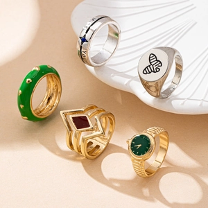 Vintage ring set featuring silver Miss You and bee icons with gold green enamel accents