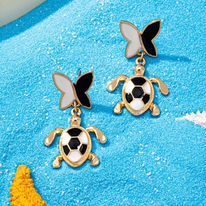 Summer turtle and butterfly dangle earrings with black and white enamel on blue sand