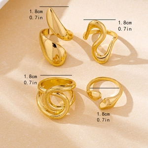 Set of four gold irregular fluid rings featuring sleek entwined and layered designs
