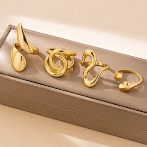 Minimalist 4-piece golden interlocking ring set with abstract geometric designs