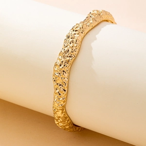 Elegant gold textured irregular geometric bracelet with handcrafted hammered finish