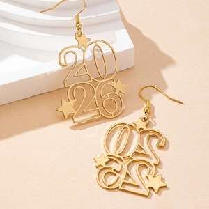 Golden 2026 New Year drop earrings with star accents on a professional display stand