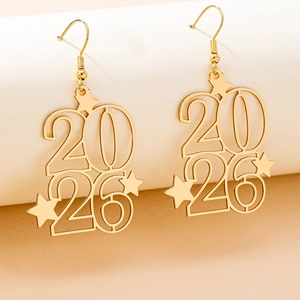 Close-up of 2026 gold-plated drop earrings with hollow star detail and year engraving