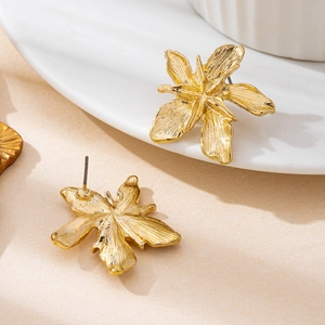 Exquisite gold alloy lily flower stud earrings with detailed brushed petal texture