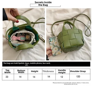 Detailed size chart for the woven green handbag showing 23cm width and dimensions