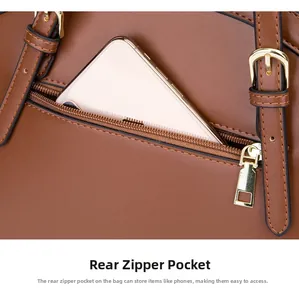 Detailed view of the back zipper pocket on brown leather shell bag for smartphones