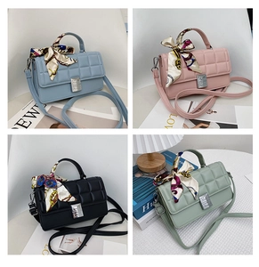 Detail of square crossbody bags in four colors with quilted texture and silk scarf handle