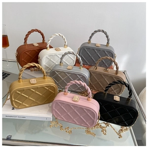 Detailed grid of quilted crossbody bags in eight vibrant colors with gold metal chain straps