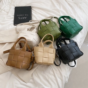 Collection of mini woven tote bags in six colors with crossbody straps and textures