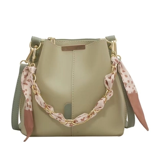 Sage green chain bucket bag with silk scarf handle and adjustable strap in plain PU leather