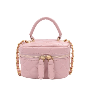 Pink quilted crossbody bag with gold chain strap and top handle on white background