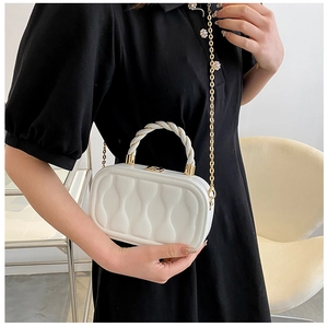 White quilted box bag with gold chain strap and stylish twisted handle detail