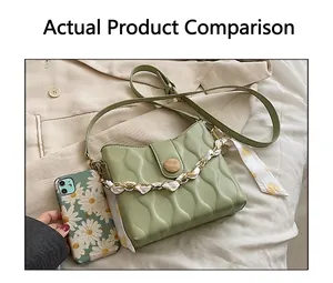 Detail of light green quilted crossbody bag with silk scarf chain handle and wood button