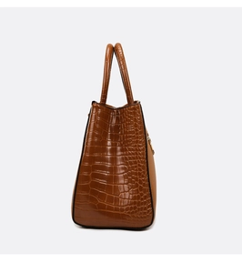 Side view of brown large capacity tote bag with embossed crocodile leather texture