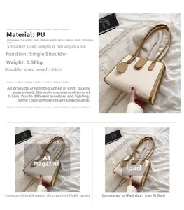 Detail of minimalist cream PU shoulder bag showing vertical pleats and tan strap contrast