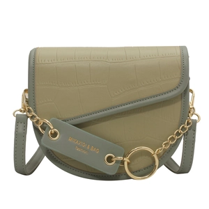 Fashionable green saddle crossbody bag with crocodile pattern and gold chain detail