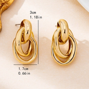 Polished gold interwoven oval hoop earrings with chic geometric minimalist design