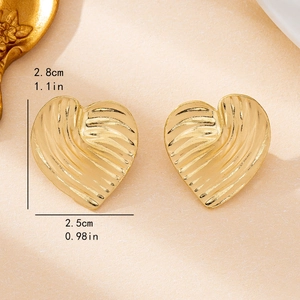 Golden heart earrings with textured wave surface and elegant matte finish for women