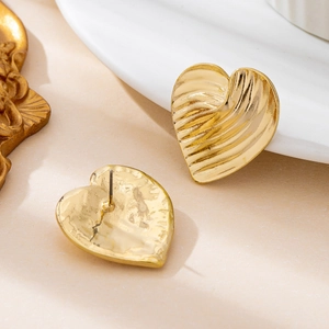 Exquisite gold crumpled heart stud earrings with geometric textured metallic finish