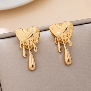 Chic gold liquid metal heart earrings featuring a modern melting lava aesthetic design