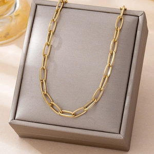 Minimalist gold paperclip link chain necklace displayed on a jewelry box for daily wear