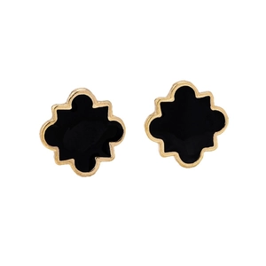 Minimalist black geometric star earrings with polished gold frames on a white backdrop