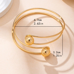 Minimalist adjustable gold spiral open bangle with polished metal ball accents