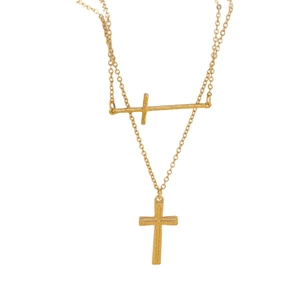 Minimalist double-layered gold necklace featuring smooth and textured cross pendants