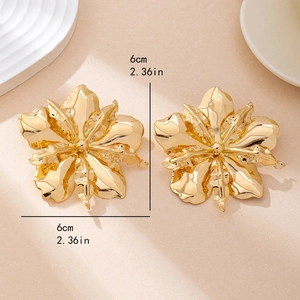Exaggerated large gold floral stud earrings featuring 3D petals and 6cm diameter size