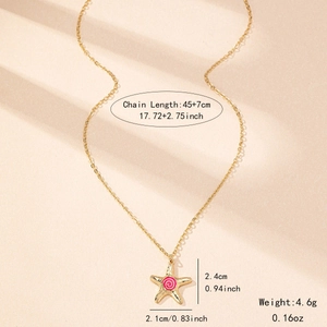 Golden starfish pendant necklace with pink enamel swirl and adjustable cable chain