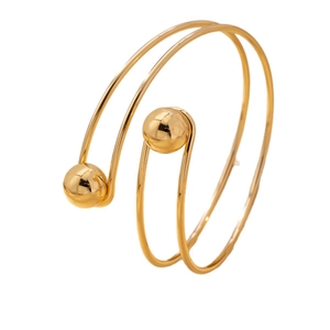 Minimalist gold spiral open bangle with a double-loop design and polished sphere ends