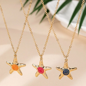 Golden starfish necklaces with colorful spiral enamel charms in a summer ocean style