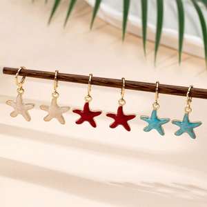 Fashion starfish drop earrings set in cream, red and blue with gold finish