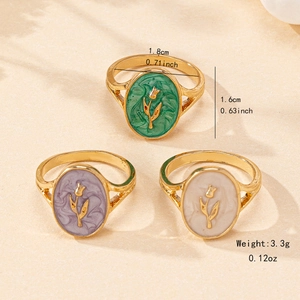Three-piece French vintage enamel tulip rings in green, purple, and cream colors