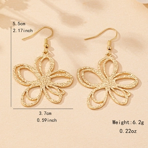 Fashionable hollow flower drop earrings in matte gold with elegant textured finish